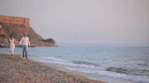 Couple Walking On Seashore Stock Footage 22424042