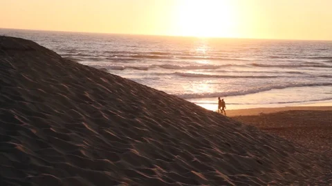 Couple Walking on Shore Stock Footage 114140719