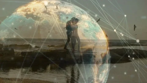 Couple walking shore, pausing and showing love, sparking tech globe mesh around 動画素材 330581504