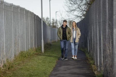 Couple Walking Side By Side Stock Photos