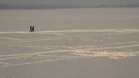 Couple walking in the snow Stock Footage 72003568
