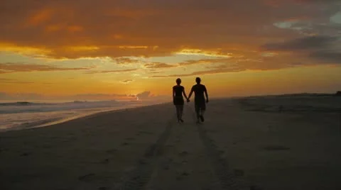 Couple walking in sunset Stock Footage 8929339
