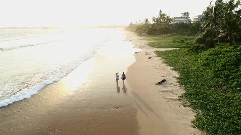 Couple Walking On Sunset Tropical Beach Stock Footage 248588462