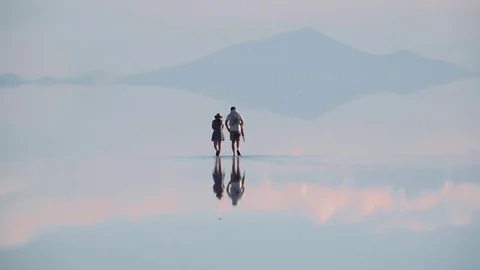 Couple walking on sunset , water reflection Stock Footage 85324763