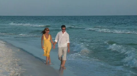 Couple walking in surf Stock Footage 299399