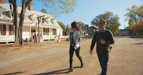 Couple Walking Through Beautiful Colonial Williamsburg in Fall Stock Footage 120927063