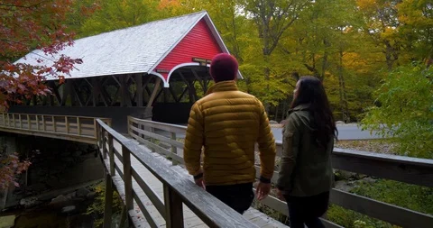 Couple Walking Through Covered Bridge, Franconia Notch New Hampshire Stock Footage 102400984