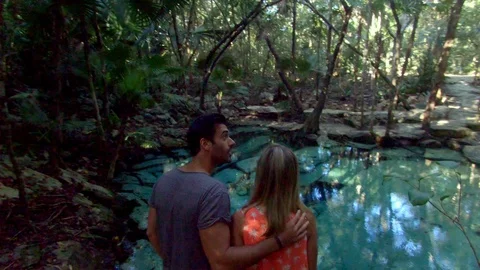 Couple Walking Through Forest in Tulum Tracking Shot Video stock 90012344