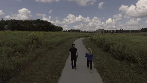 Couple Walking Through Garden Stock Footage 145236102