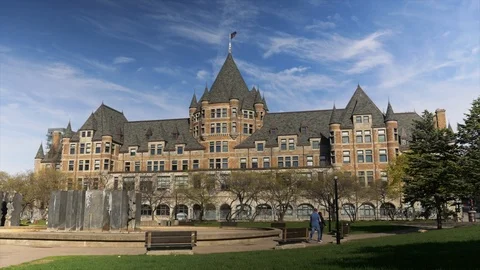 Couple walking in the Viger Parc in front of Gare Viger Montreal Quebec Canad Stock Footage 108600153
