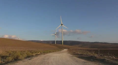 Couple walking to wind energy Stock Footage 21930677