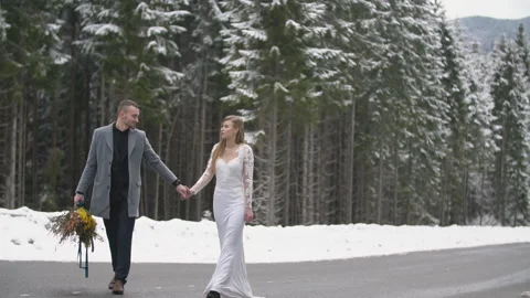 Couple walking in the winter forest Stock Footage 147601999
