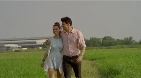 Couple walks back from the fields Stock Footage 63084390