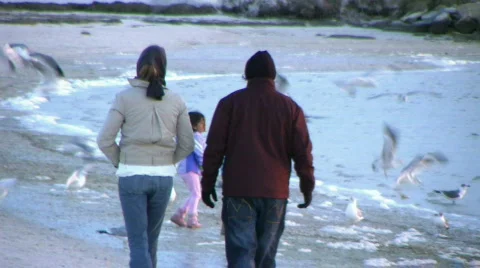Couple Walks Down Beach 스톡 동영상 720622