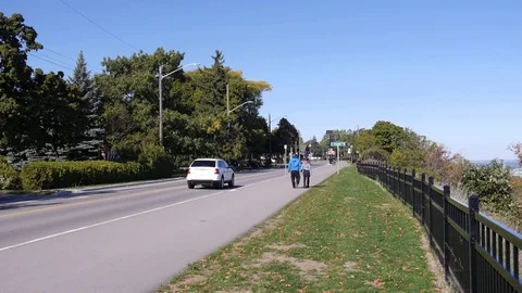 Couple walks down outdoor path - nature Stock Footage 74070227