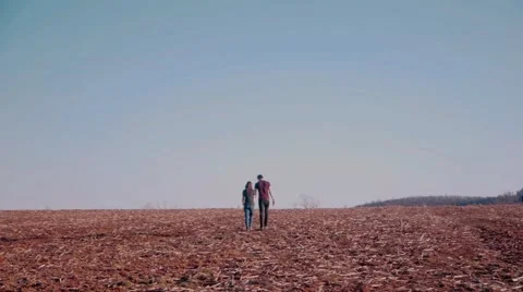 Couple Walks Off Into Field Stock Footage 52995519