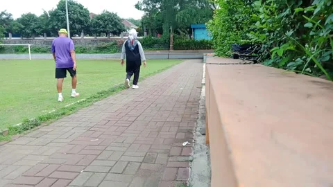 A couple walks on a jogging track Stock Footage 293412472