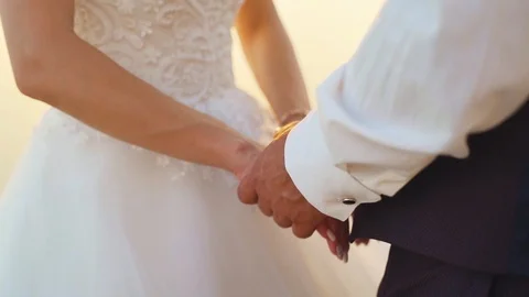 Couple walks out to ocean cliffs, takes in view together. Slow motion. Stock Footage 107812927