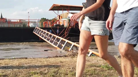 Couple walks on a riverside (slow motion) Stock Footage 159654023
