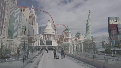 Couple Walks with Suitcases in Empty Las Vegas Strip Stock Footage 126562102