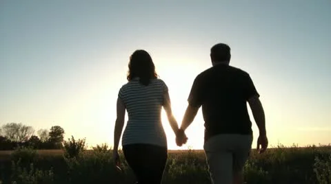 Couple Walks into Sun Video stock 12576729