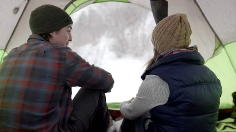 Couple Watch The Snow Come Down From Their Tent In Utah Mountains Video stock 71819486