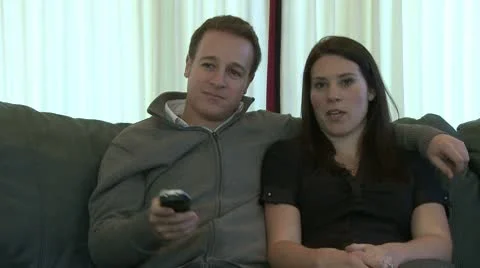 Couple watches television together (1 of 3) Stock Footage