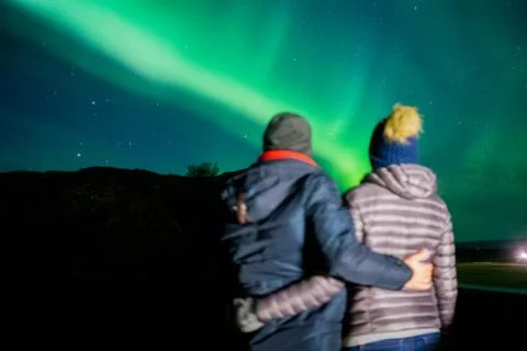 Couple watching the aurora Stock Photos