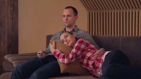 Couple watching comedy on tv on sofa Stock Footage 72478640