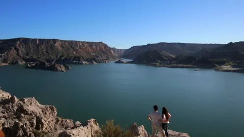 Couple watching a lake Stock Footage 117004273