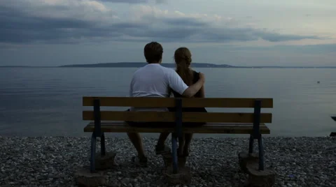 Couple watching river in the evening 스톡 동영상 65504879