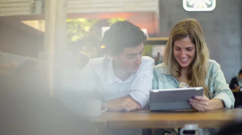 Couple watching streaming video on digital tablet together Stock Footage 63281353