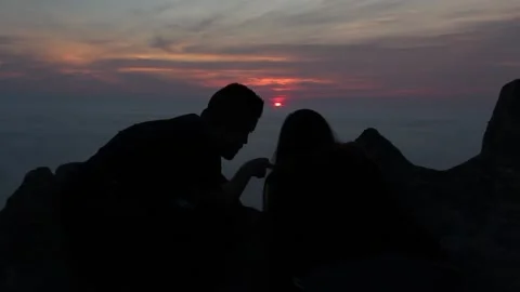 COUPLE WATCHING THE SUNSET Stock Footage 94230954