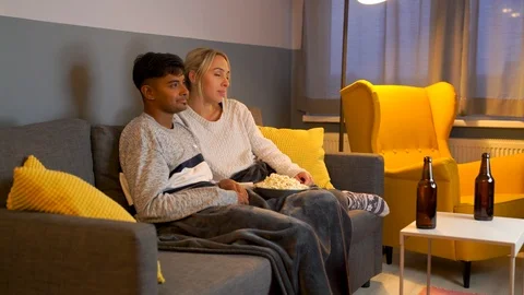 Couple watching TV during the evening in the living room. Stock Footage 119302736