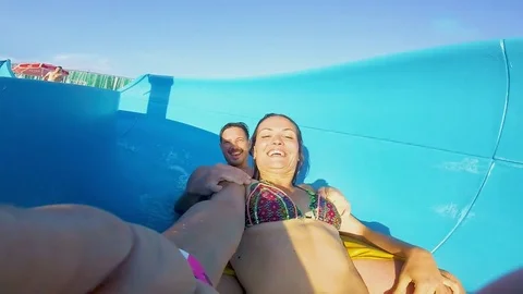 A couple on water slide Stock Footage 85386352