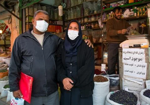 A couple wearing face masks to protect from h1n1 influenza in ganjali bazaar, Stock Photos