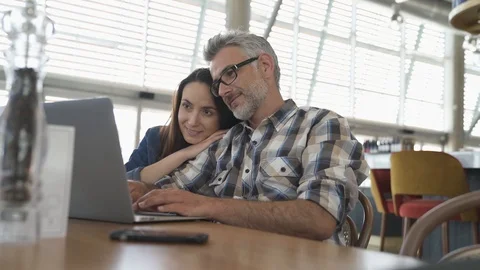 Couple websurfing on laptop computer Stock Footage 89466422