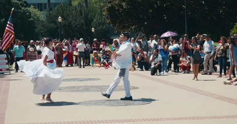 Couple in white dancing together outside the capital Stock Footage 280332330