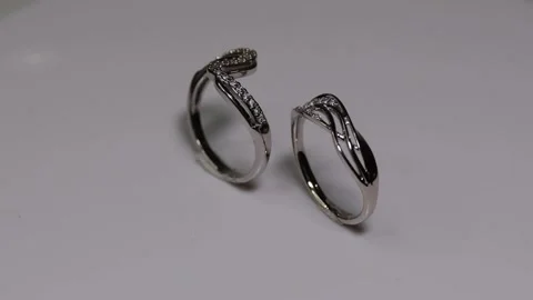 A couple white wedding ring move smoothly Stock Footage 271074491