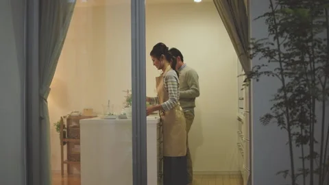 A couple who prepare dinner in the kitchen Stock Footage 159813738