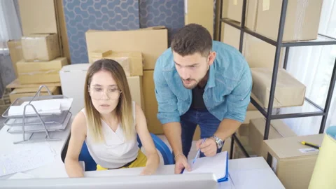 The couple, who sells with e-commerce, organizes the parcels Stock Footage 219676122