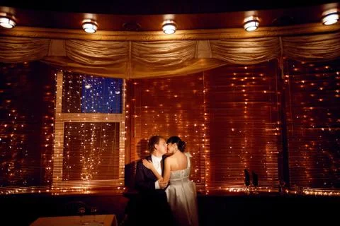Couple by the window with lights Stock Photos