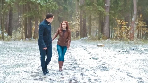 Couple Winter Snow coniferous forest Walking Man And Woman Holding Hands In Stock Footage 80145955