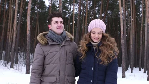 Couple Winter Snow Forest Walking Happy Smiling Man And Woman Holding Hands In Stock Footage 70989540