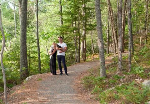 Couple in the woods on a path Stock Photos