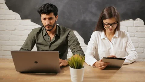 Couple Work with Laptop and Tablet Видео 92697441