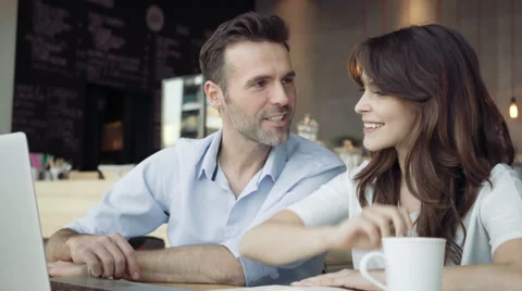 Couple working in cafe with laptop Video stock 64650557
