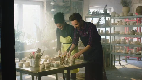Couple Is Working With Clay In Pottery Workshop Stock Footage 169055785