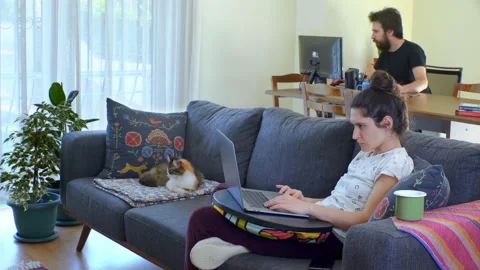 Couple is working at home together on computer 動画素材 130325083