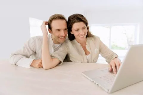 Couple working on a laptop Stock Photos